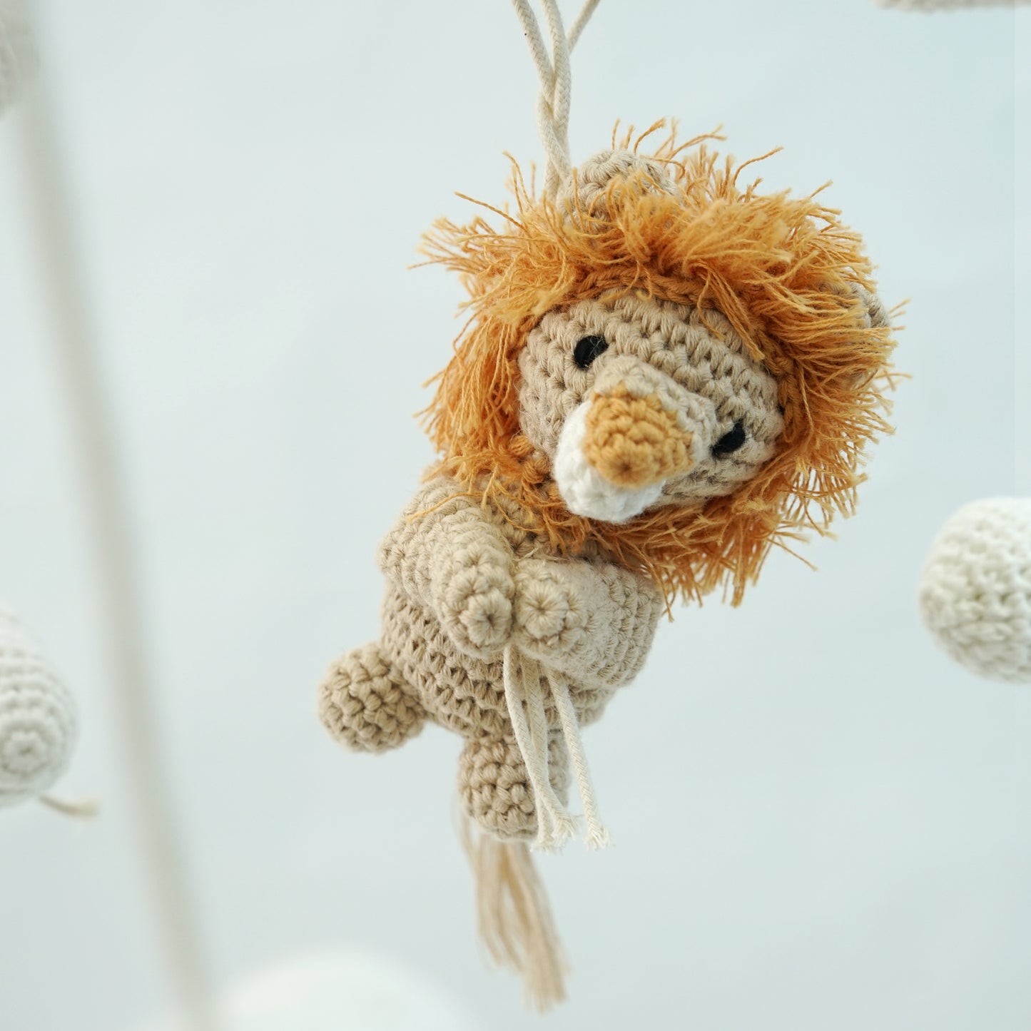Crocheted beige lion with burnt orange mane