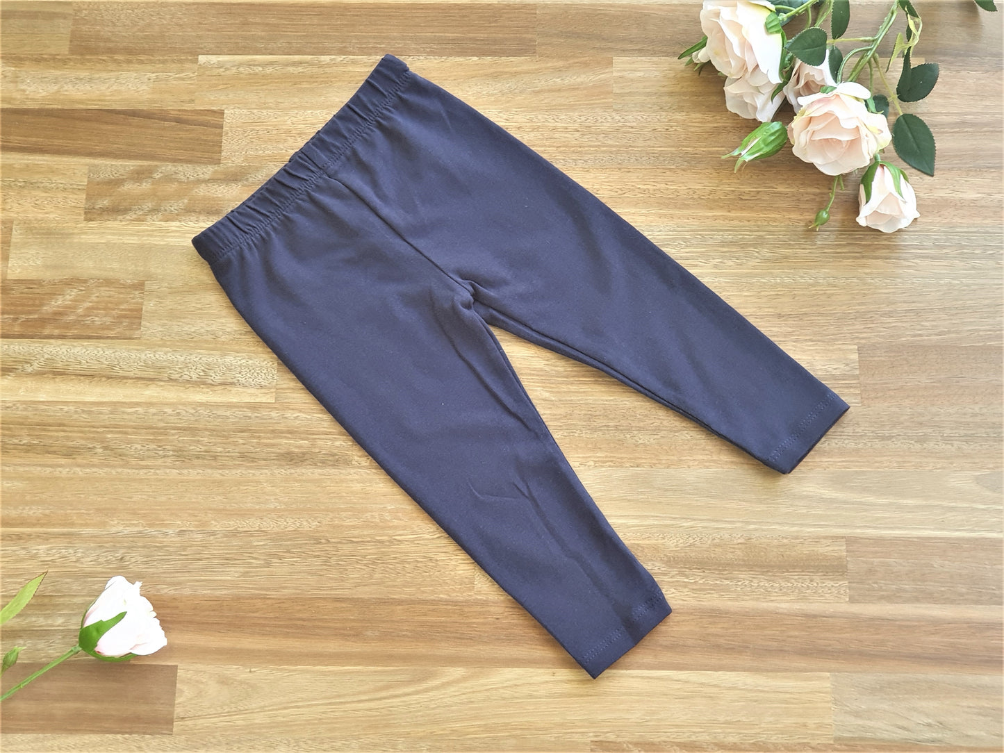 A pair of navy blue children's leggings size 0.