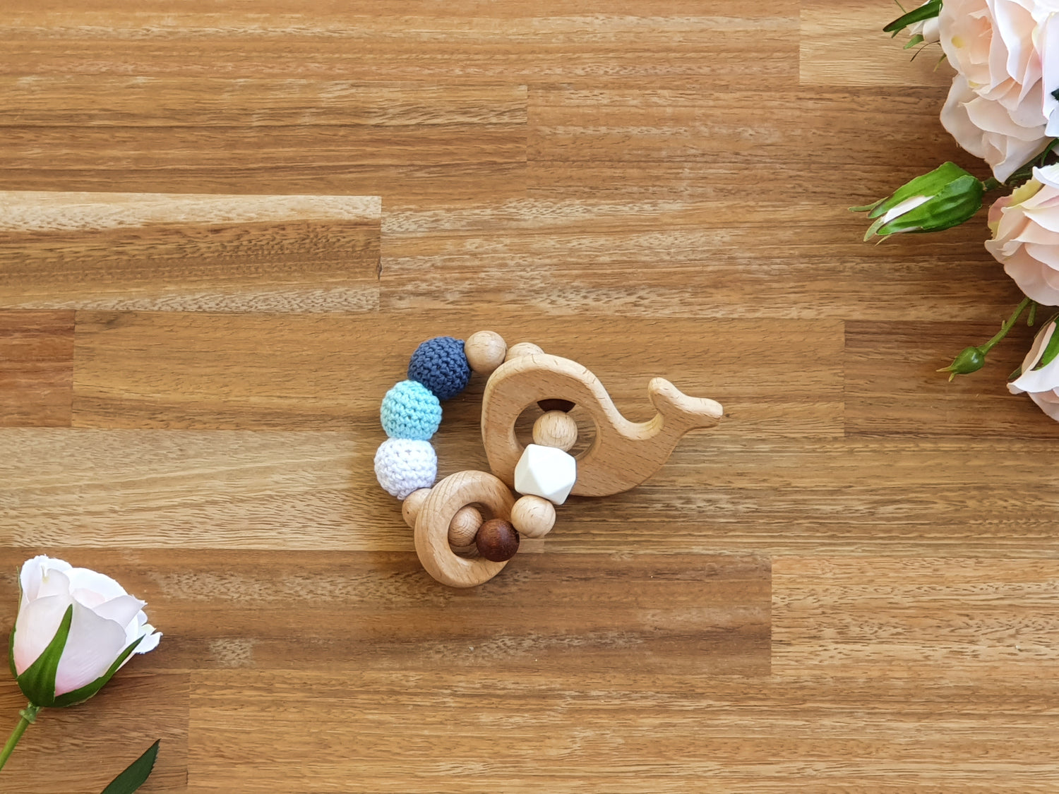 beaded toy ring with wooden whale 